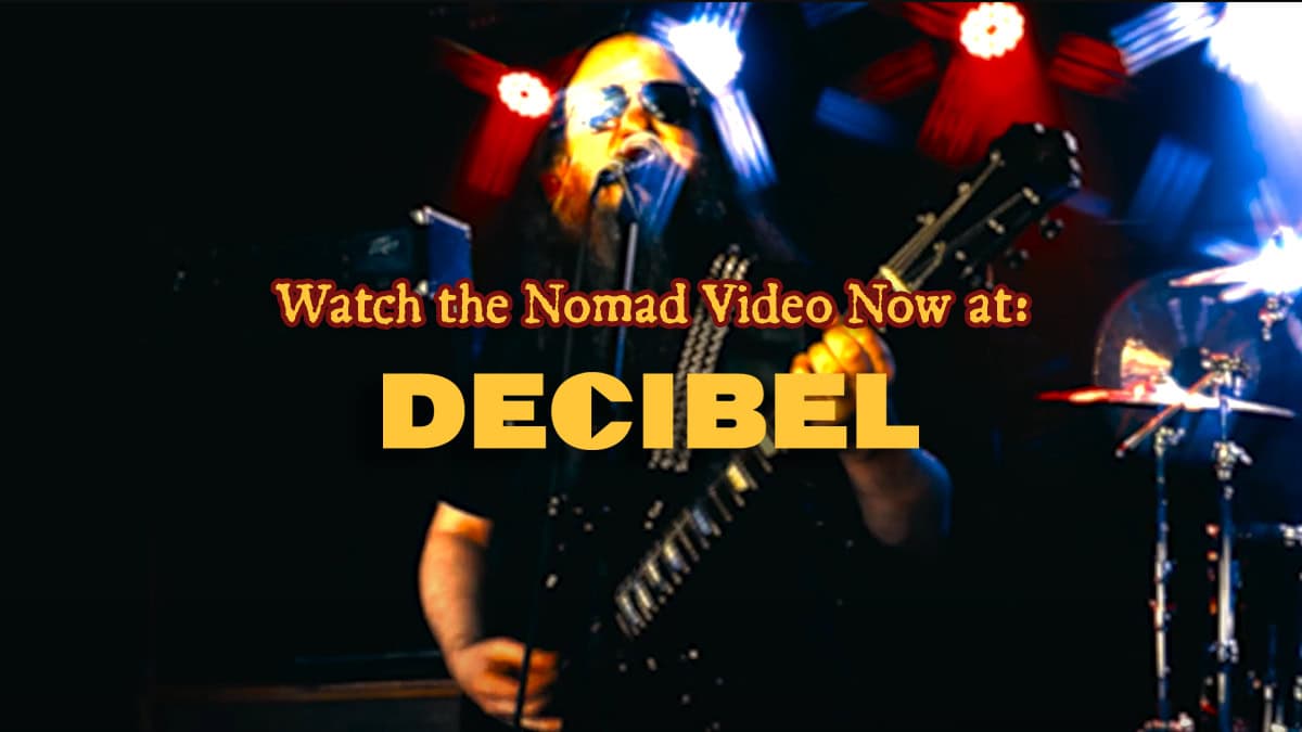 Brian Magar of Cultic Playing Guitar with Decibel Logo